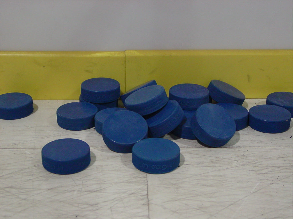 Blue ADM 8U ice hockey pucks